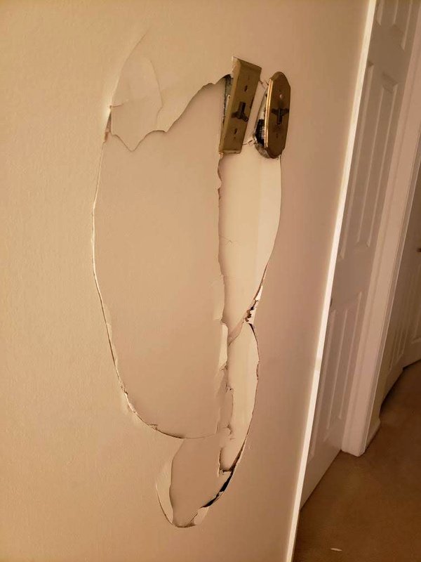 Wall Patch After Electrical Work — before